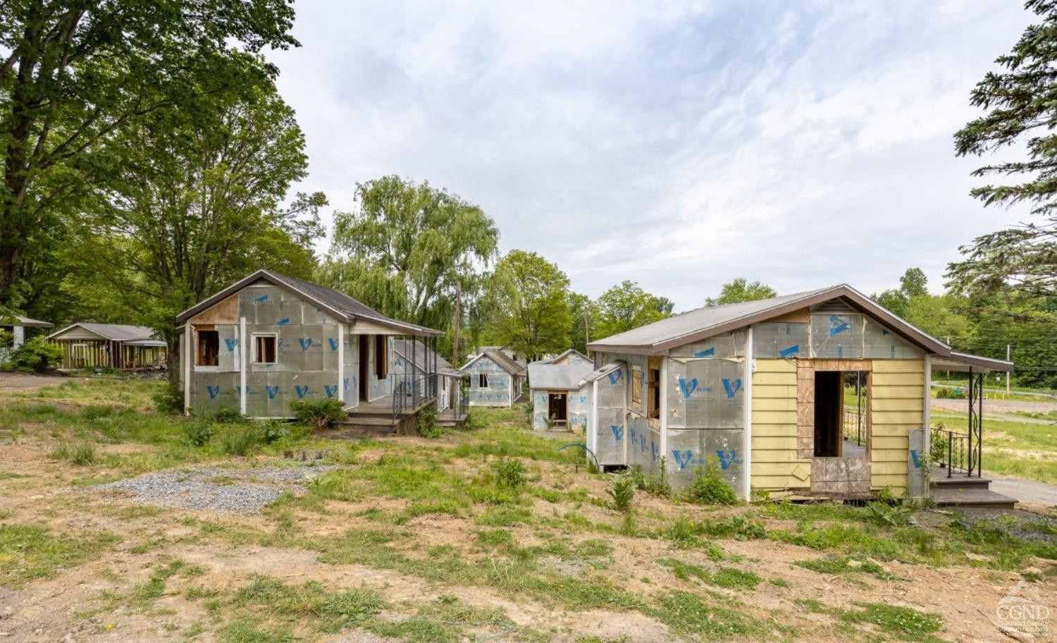 875 Road 23B Leeds, NY 12451 - Photo 4 of 38 a house with trees in the background