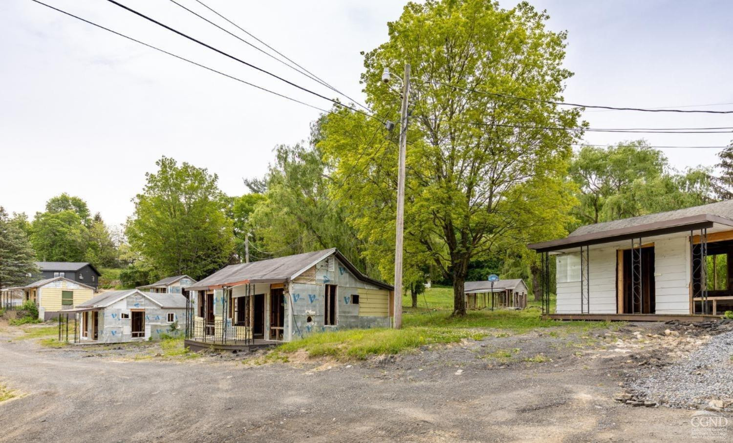 875 Road 23B Leeds, NY 12451 - Photo 6 of 38 a front view of a house with a yard and garage