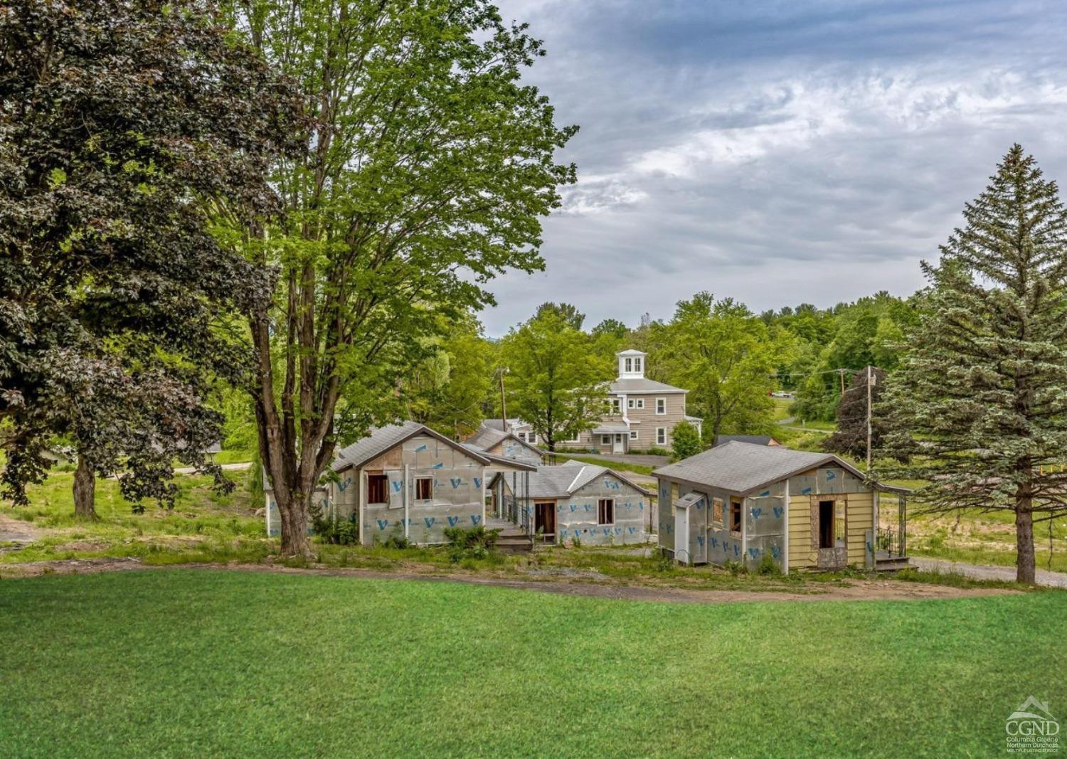 875 Road 23B Leeds, NY 12451 - Photo 10 of 38 a front view of a house with a garden