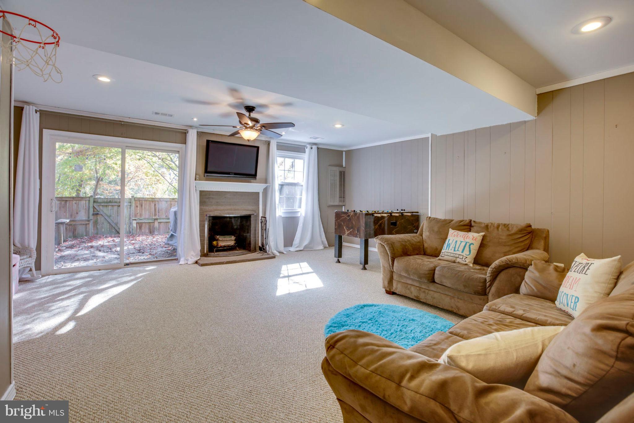 8094 Sleepy View Lane Springfield, VA 22153 - Photo 62 of 76 Lower level Family room w Fireplace