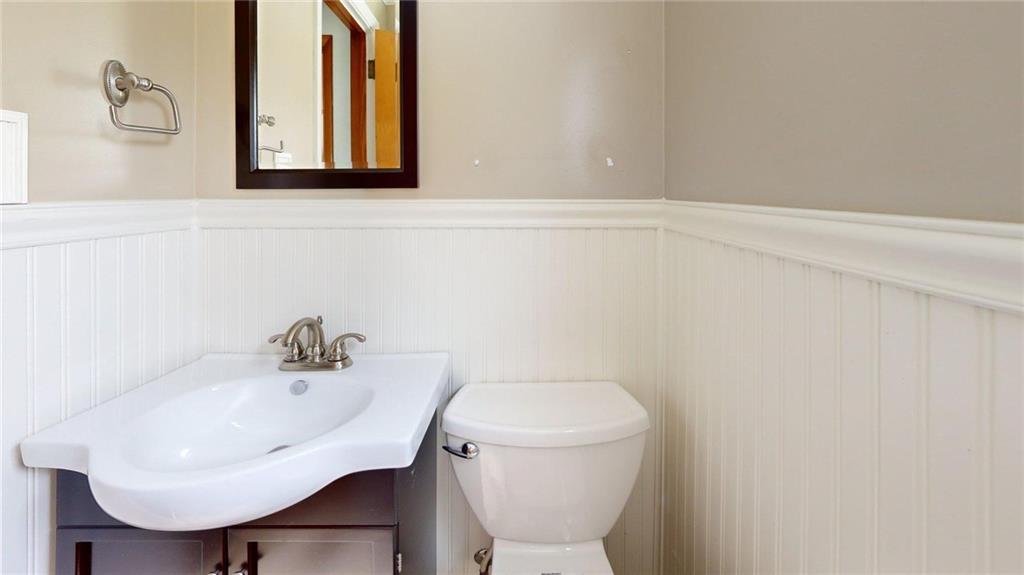 121 Rosemont Drive Coraopolis, PA 15108 - Photo 17 of 29 a bathroom with a sink a toilet and mirror