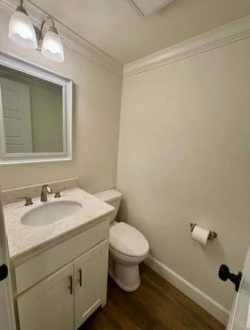 a bathroom with a sink a toilet and vanity
