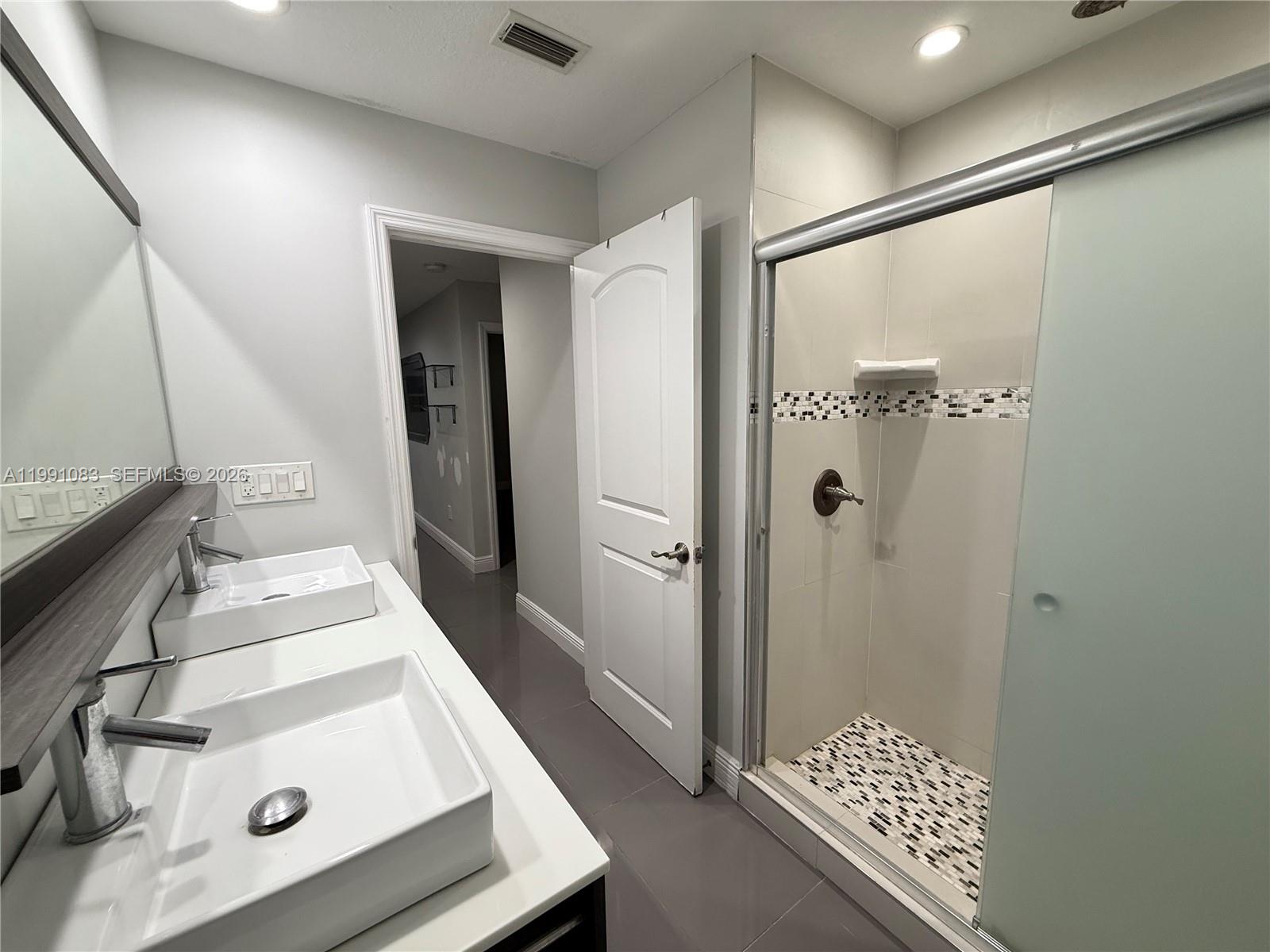 5488 Fearnley Road Lake Worth, FL 33467 - Photo 12 of 40 a bathroom with a sink