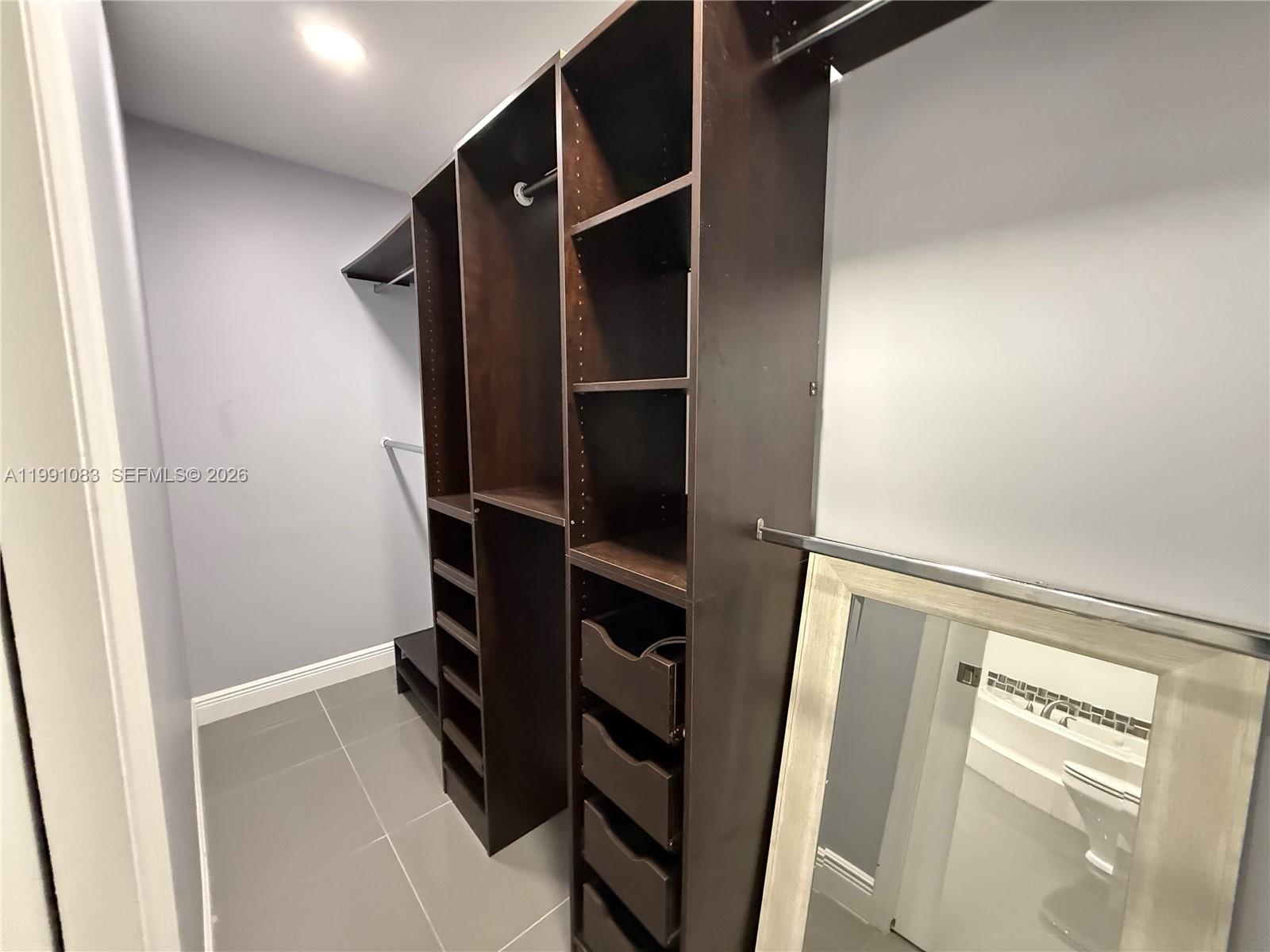 5488 Fearnley Road Lake Worth, FL 33467 - Photo 19 of 40 a view of walk in closet