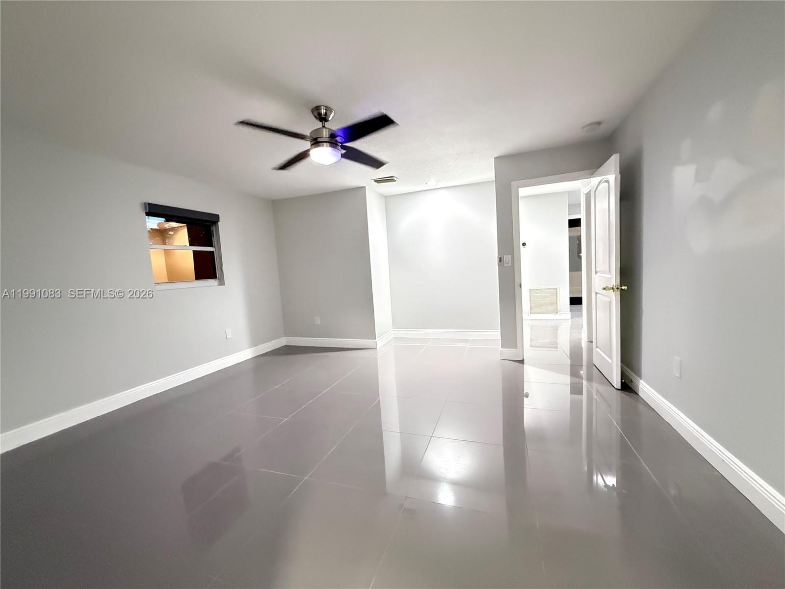 5488 Fearnley Road Lake Worth, FL 33467 - Photo 20 of 40 a view of a hallway with wooden floor