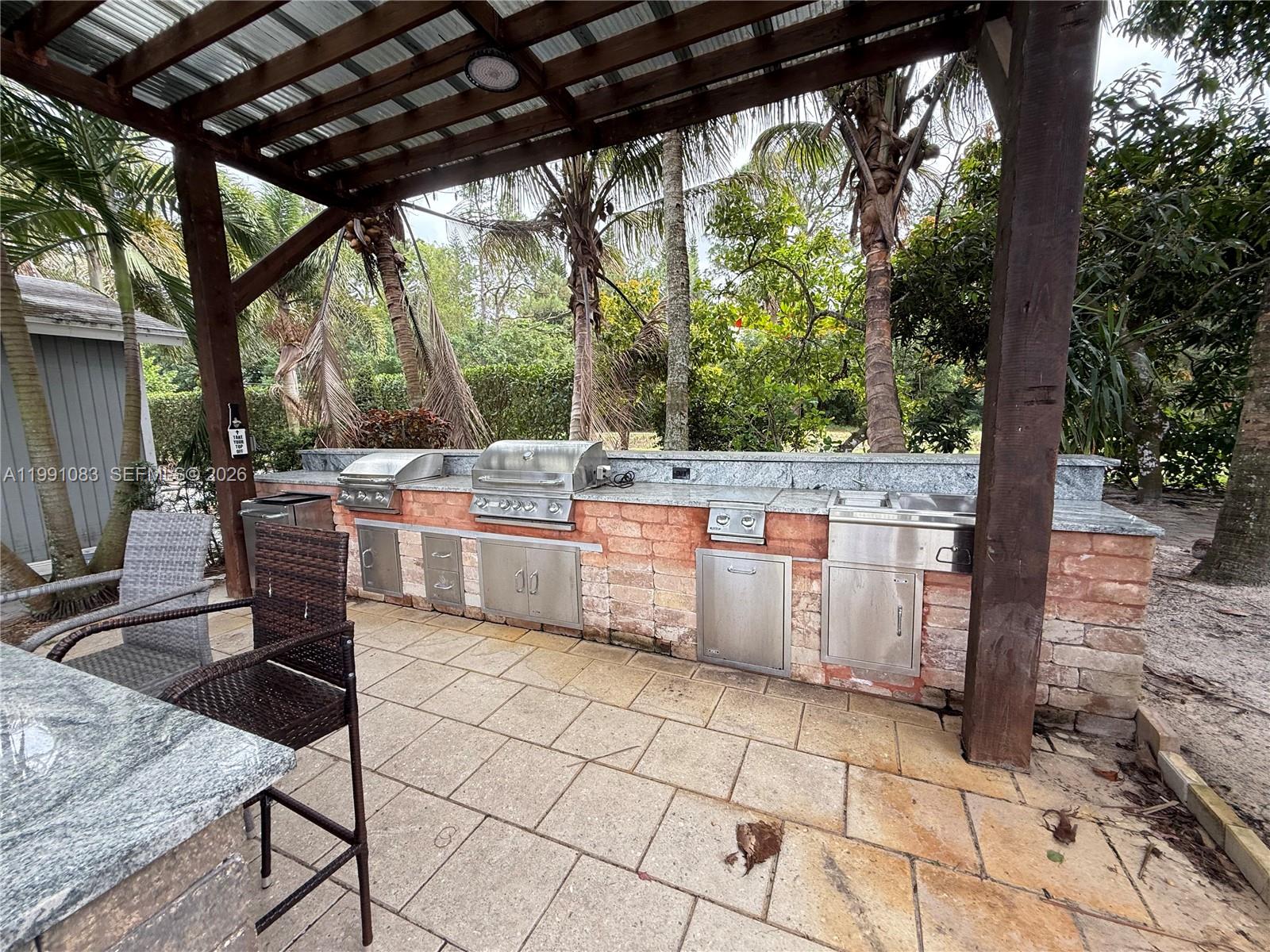 5488 Fearnley Road Lake Worth, FL 33467 - Photo 22 of 40 a outdoor space with chairs