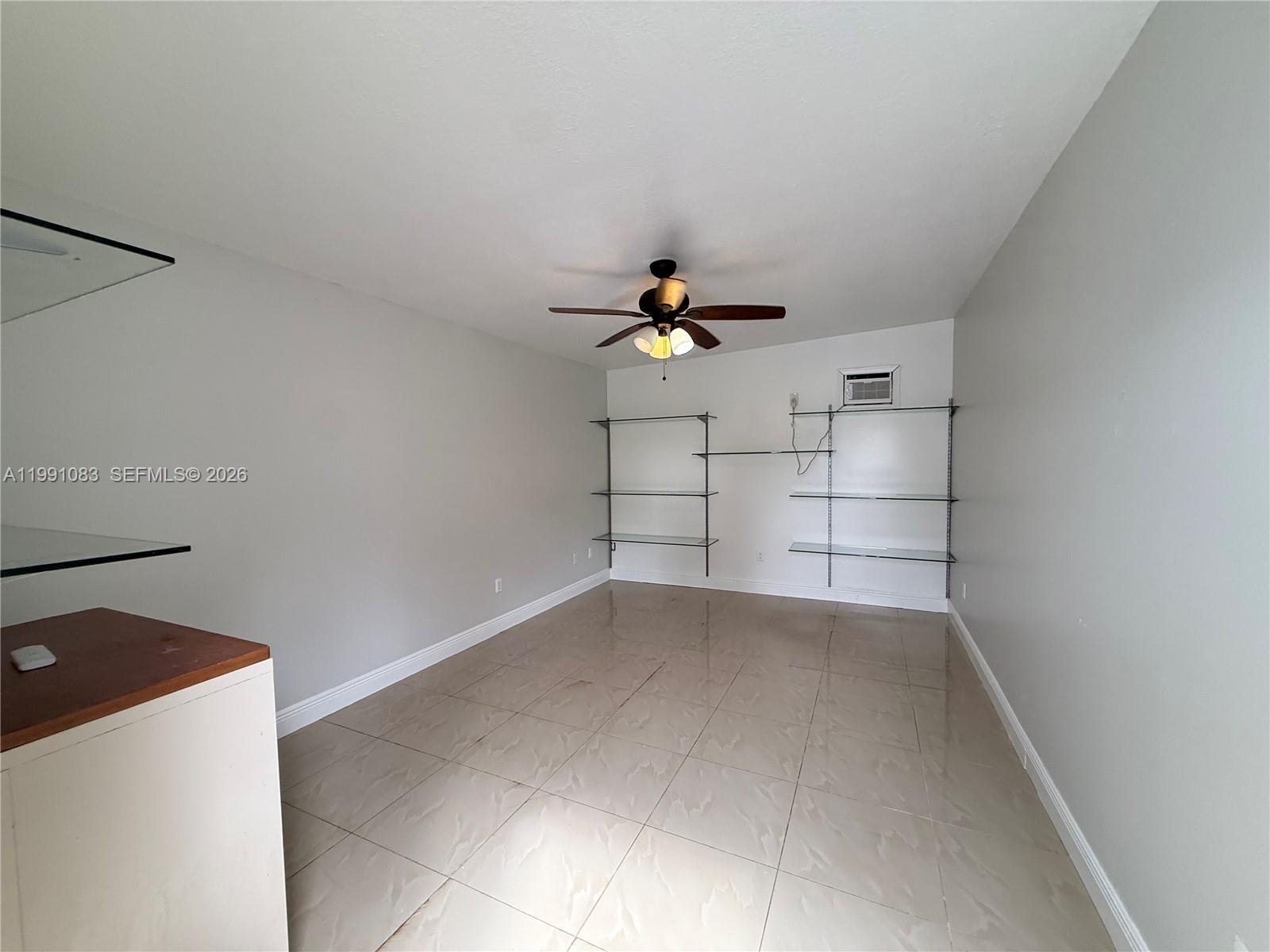 5488 Fearnley Road Lake Worth, FL 33467 - Photo 24 of 40 a view of a livingroom with a cabinets