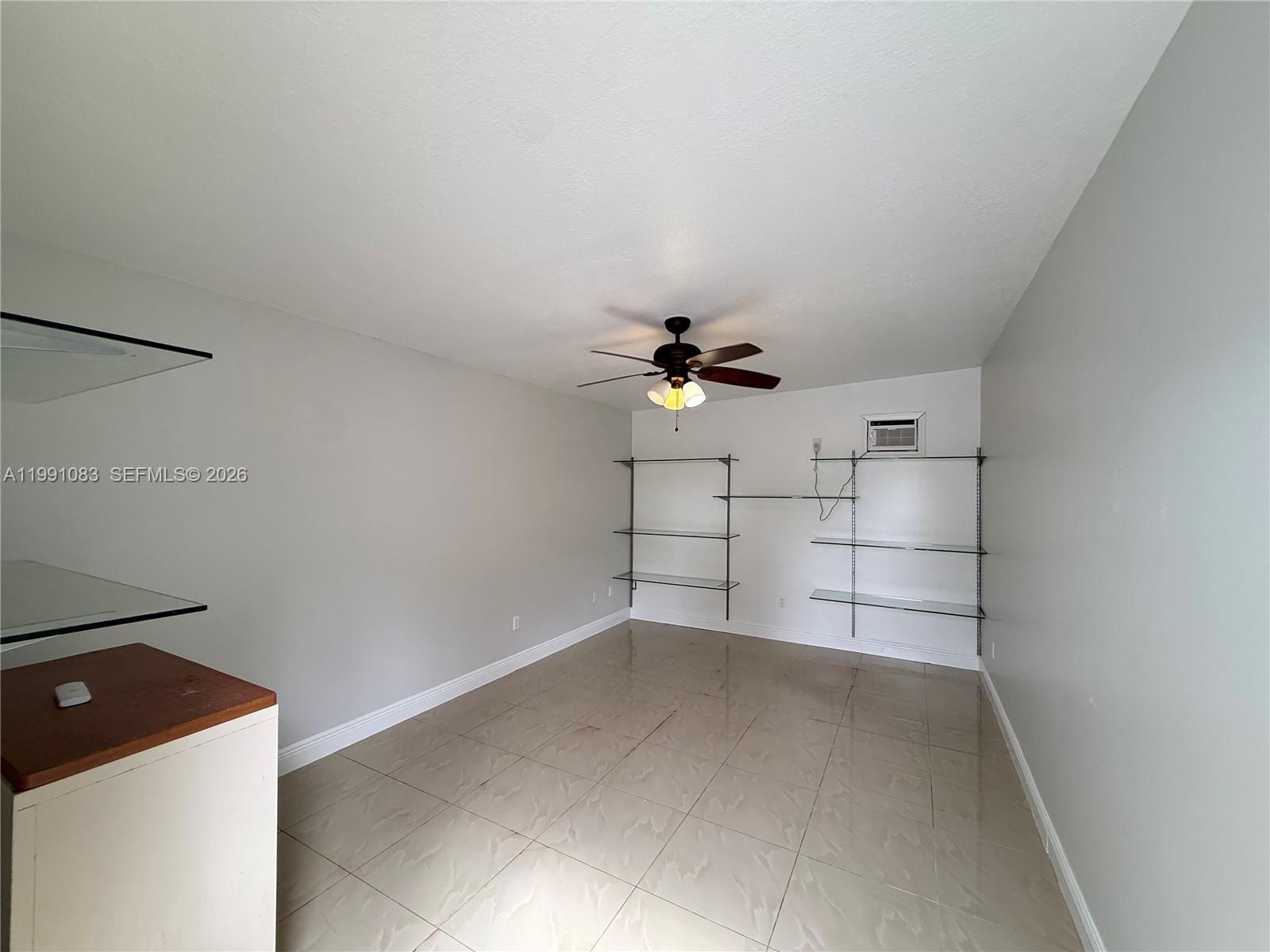 5488 Fearnley Road Lake Worth, FL 33467 - Photo 25 of 40 a view of a storage & utility room with racks on the wall