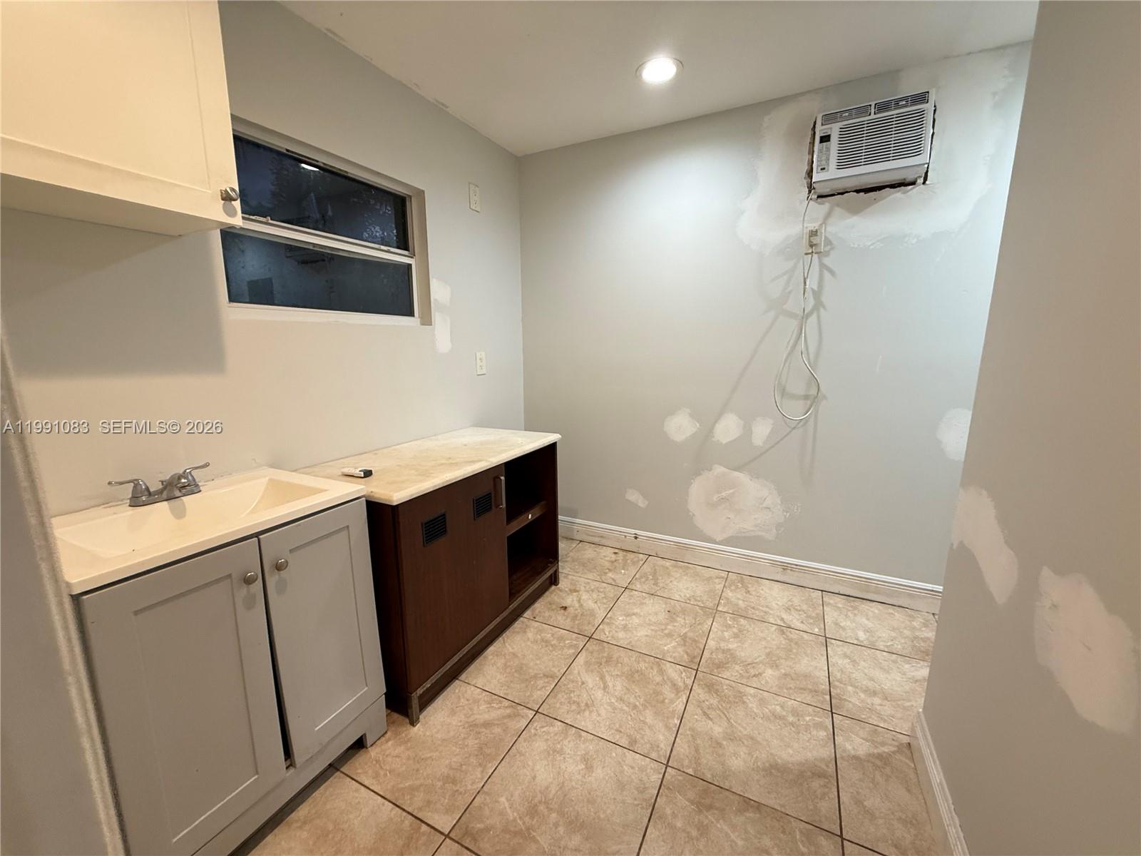 5488 Fearnley Road Lake Worth, FL 33467 - Photo 30 of 40 a bathroom with a sink a toilet and shower