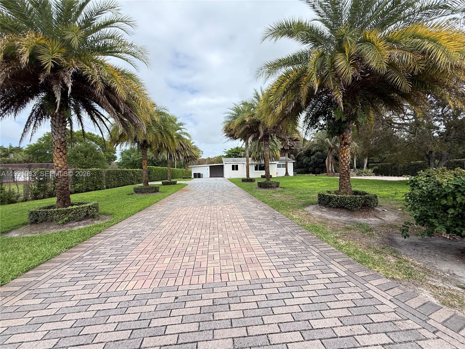 5488 Fearnley Road Lake Worth, FL 33467 - Photo 36 of 40 a view of a park with swings and slides