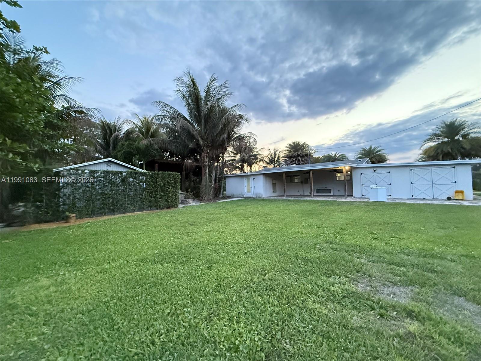 5488 Fearnley Road Lake Worth, FL 33467 - Photo 39 of 40 a view of a house with a backyard