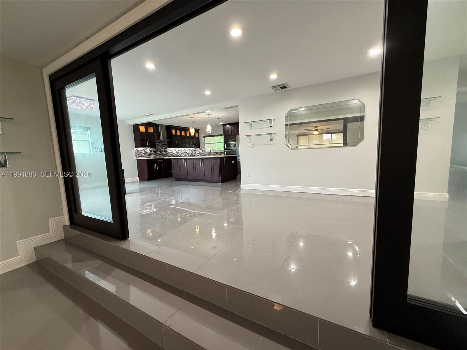 5488 Fearnley Road Lake Worth, FL 33467 - Photo 6 of 40 a view of a refrigerator and window