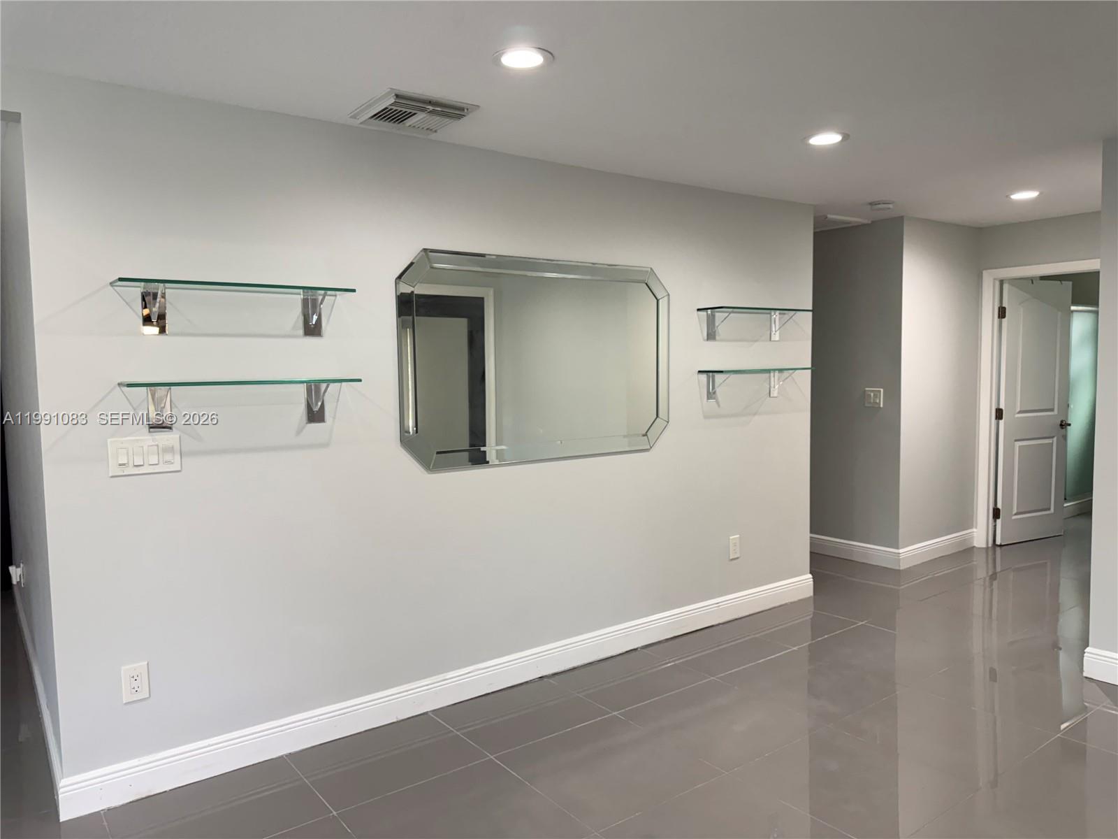 5488 Fearnley Road Lake Worth, FL 33467 - Photo 7 of 40 a view of a livingroom with wooden floor