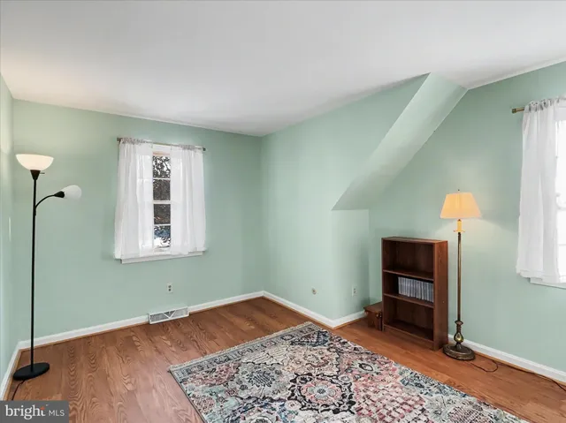 a room that has a bed and a window in it