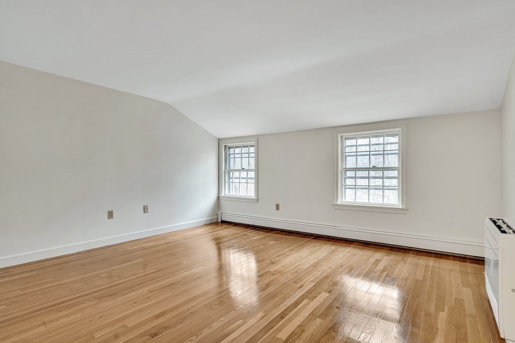 16 Nickerson Road Lexington, MA 02421 - Photo 15 of 41 an empty room with wooden floor and windows