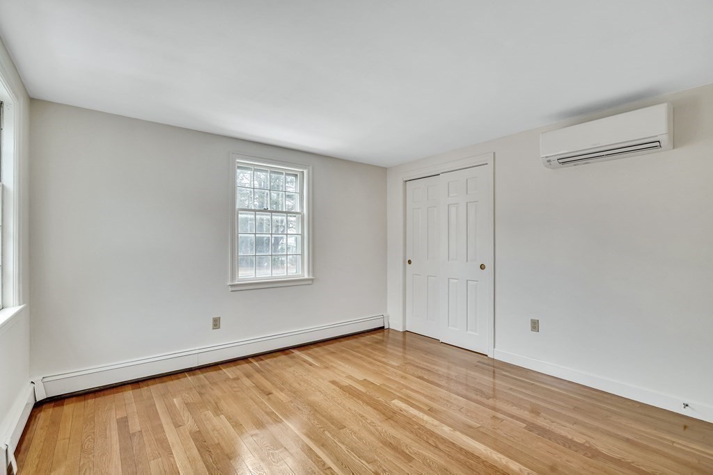16 Nickerson Road Lexington, MA 02421 - Photo 18 of 41 a view of an empty room with wooden floor and a window