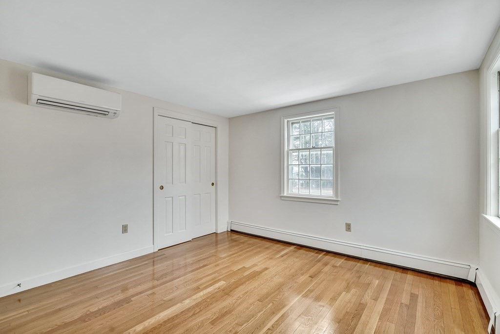 16 Nickerson Road Lexington, MA 02421 - Photo 25 of 41 a view of an empty room with wooden floor and a window