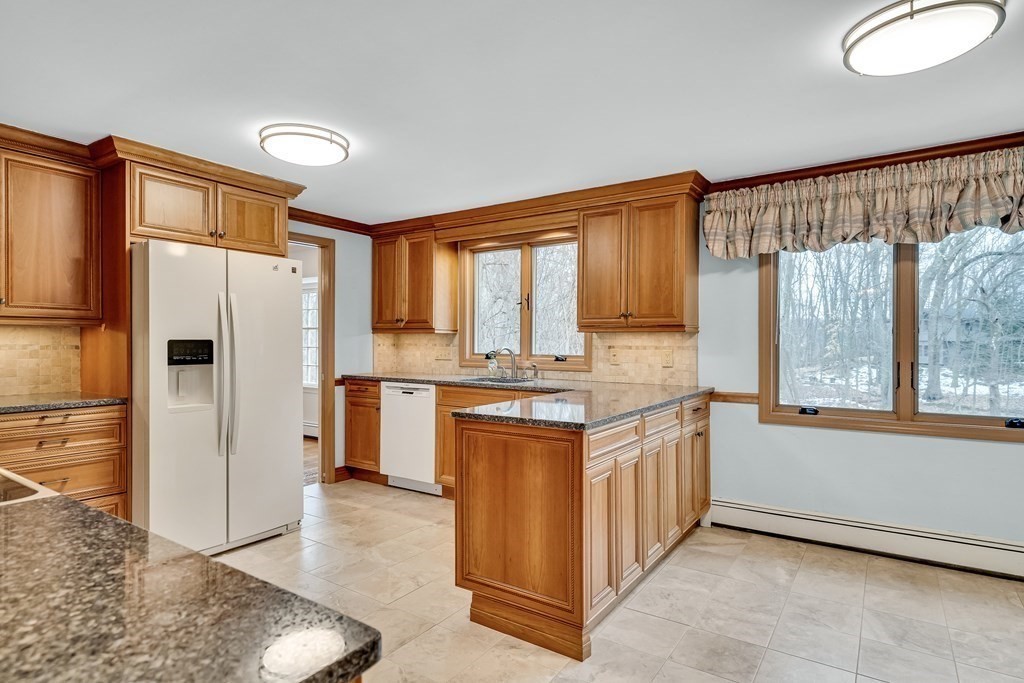 16 Nickerson Road Lexington, MA 02421 - Photo 28 of 41 a kitchen with stainless steel appliances granite countertop a refrigerator a sink and a stove