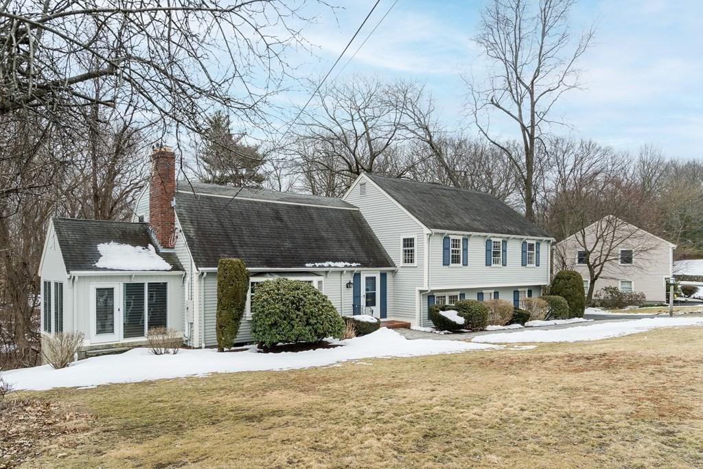16 Nickerson Road Lexington, MA 02421 - Photo 37 of 41 a front view of a house with a yard covered with snow