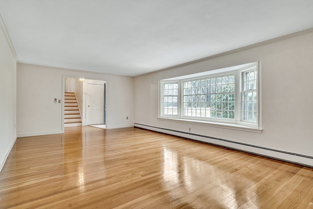 16 Nickerson Road Lexington, MA 02421 - Photo 4 of 41 an empty room with wooden floor and windows