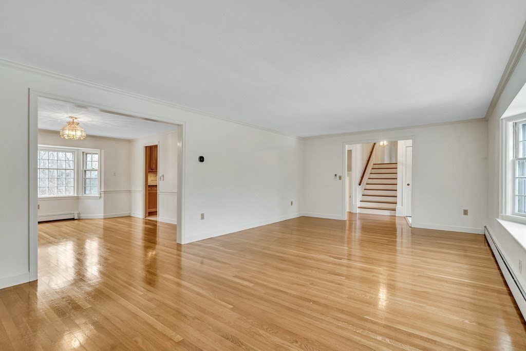16 Nickerson Road Lexington, MA 02421 - Photo 6 of 41 a view of an empty room with wooden floor and a window
