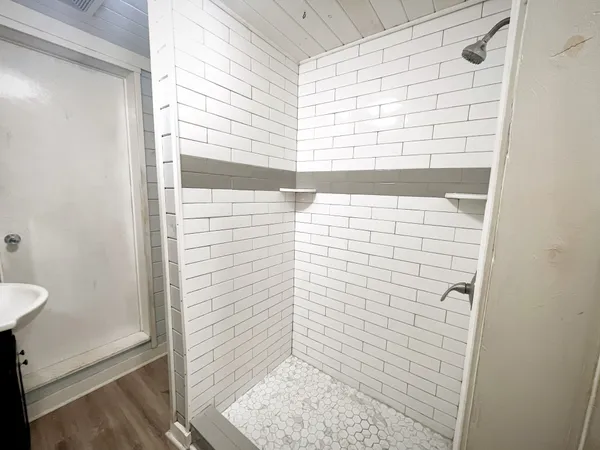 a bathroom with a toilet and a shower
