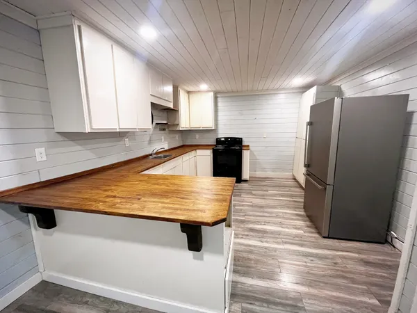 a view of a street with a building in the background