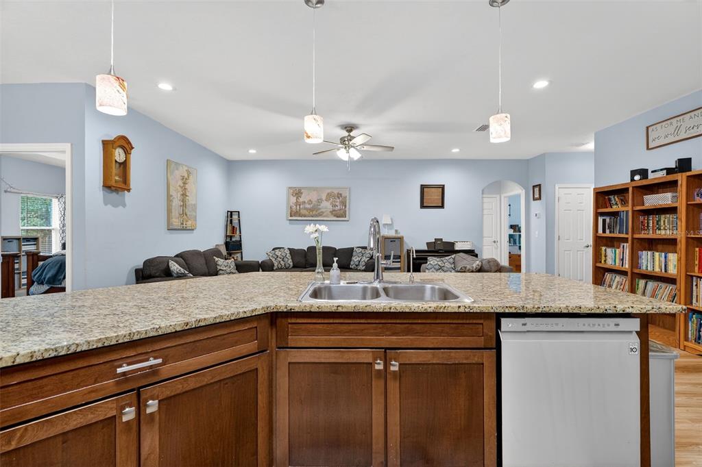 30 Deer Trail Circle Bronson, FL 32621 - Photo 13 of 55 a kitchen with a granite countertop sink and dishwasher