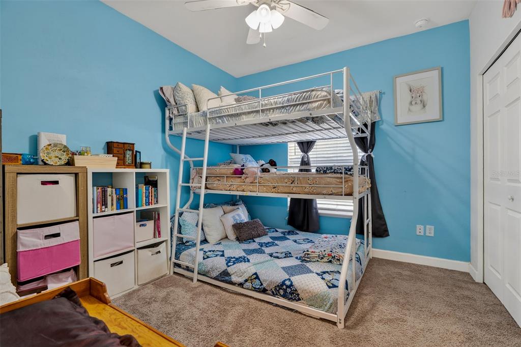 30 Deer Trail Circle Bronson, FL 32621 - Photo 21 of 55 a bedroom with furniture and a baby crib
