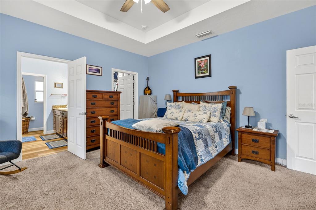 30 Deer Trail Circle Bronson, FL 32621 - Photo 26 of 55 a bedroom with a bed and a tv on the table
