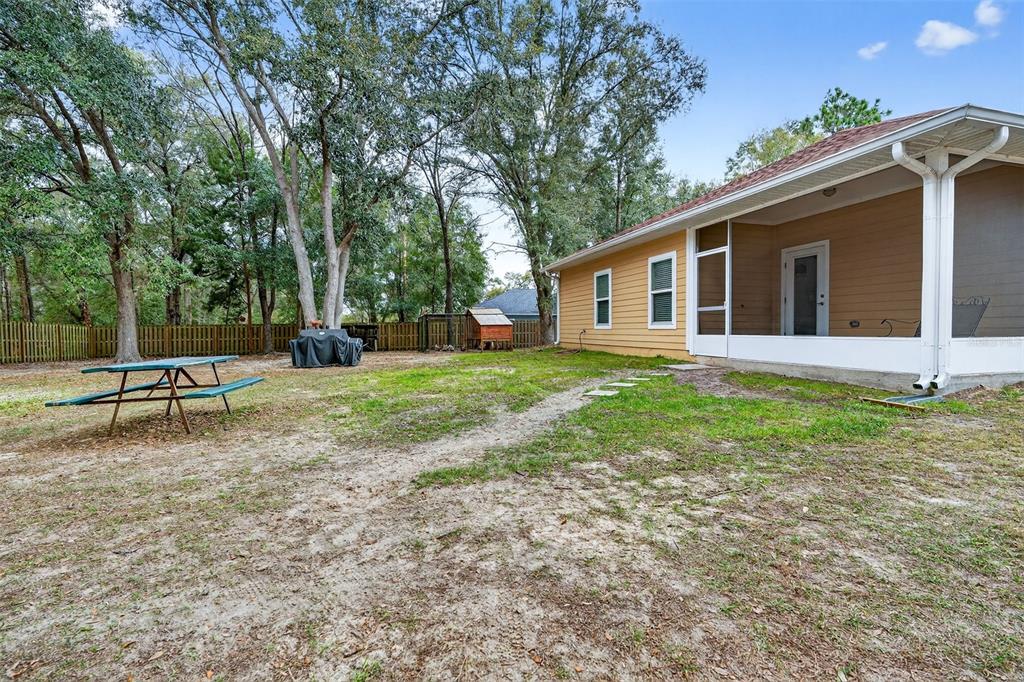 30 Deer Trail Circle Bronson, FL 32621 - Photo 39 of 55 a view of a house with a yard and sitting area