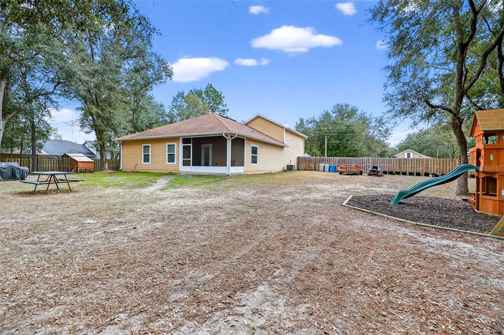 30 Deer Trail Circle Bronson, FL 32621 - Photo 40 of 55 a view of a house with a yard and large trees