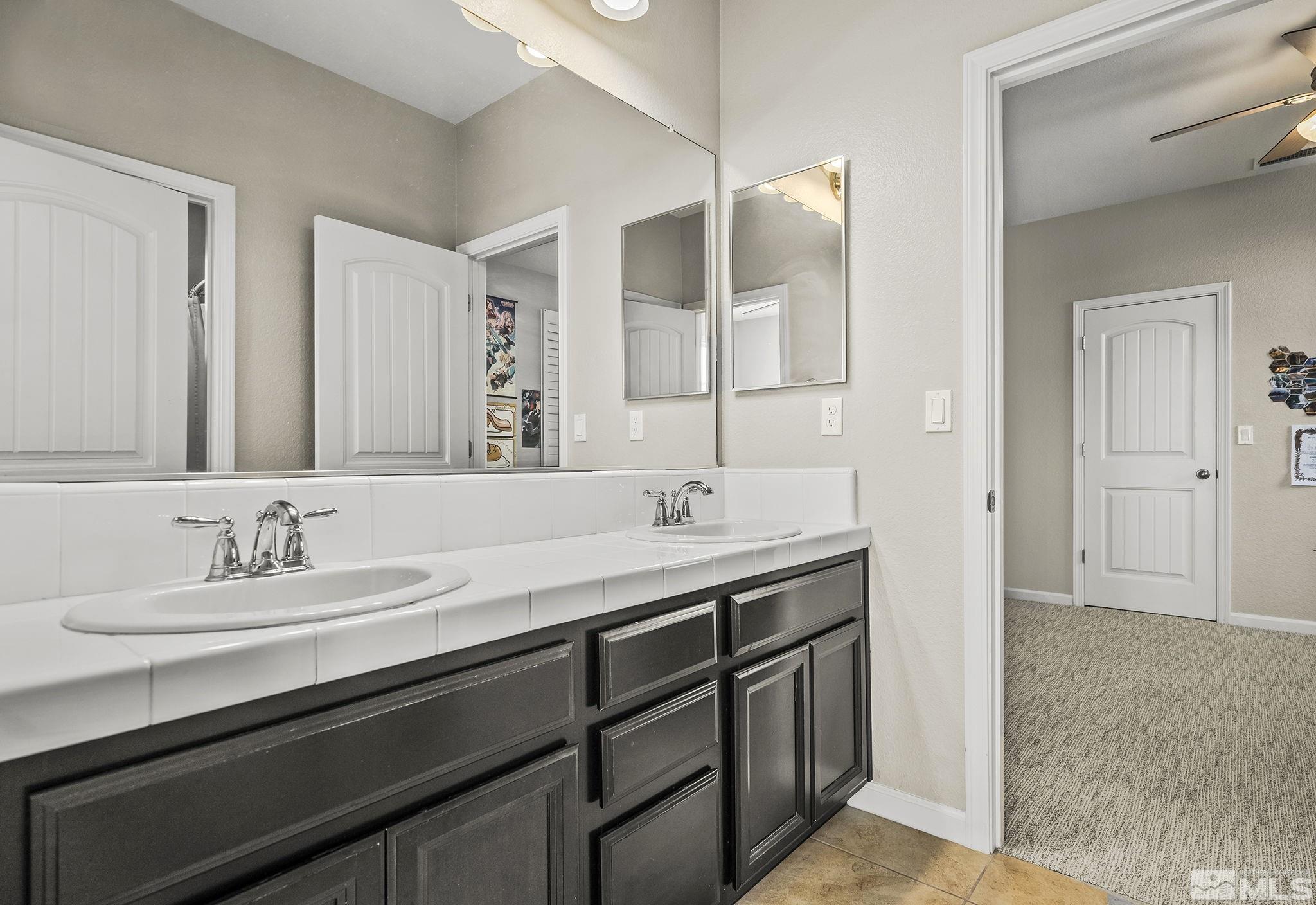 2055 Hope Valley Drive Reno, NV 89521 - Photo 11 of 21 a bathroom with a sink and a mirror