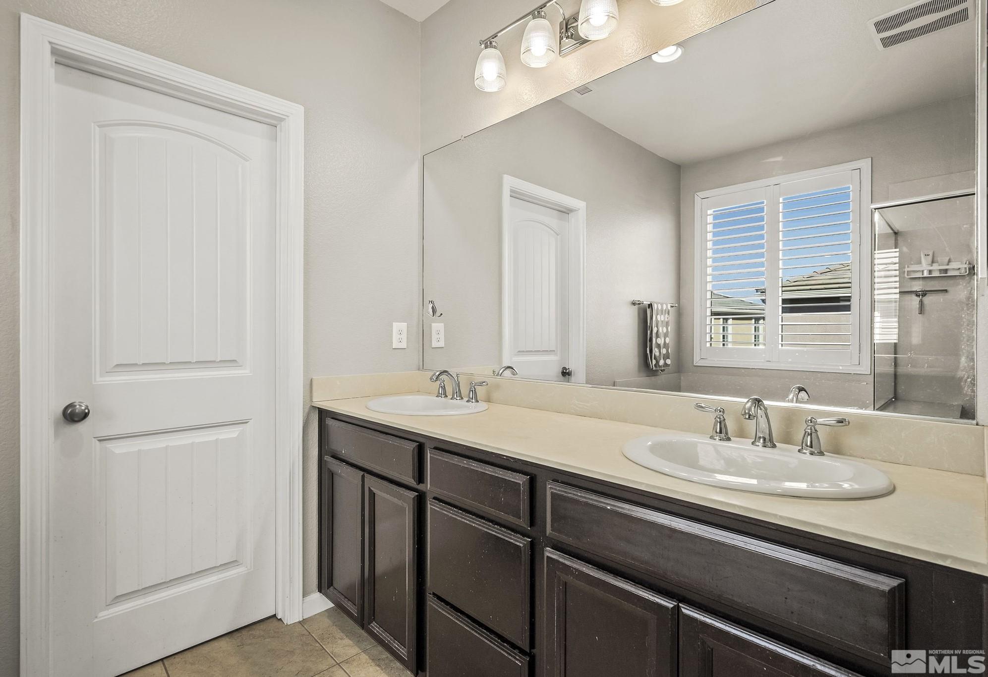 2055 Hope Valley Drive Reno, NV 89521 - Photo 12 of 21 a bathroom with a sink double vanity and a mirror