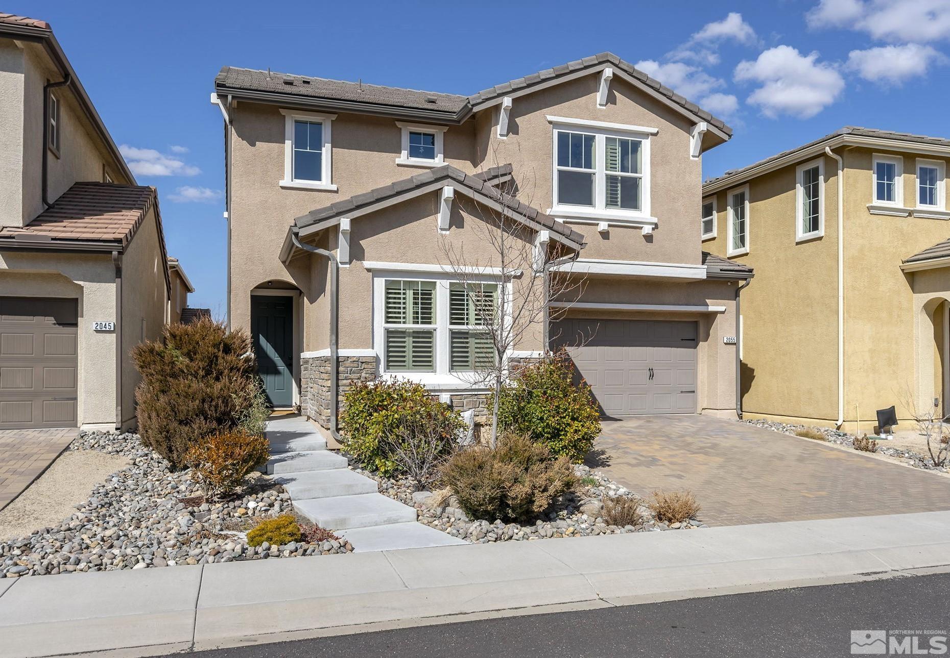 2055 Hope Valley Drive Reno, NV 89521 - Photo 21 of 21 a front view of a house with a yard and garage