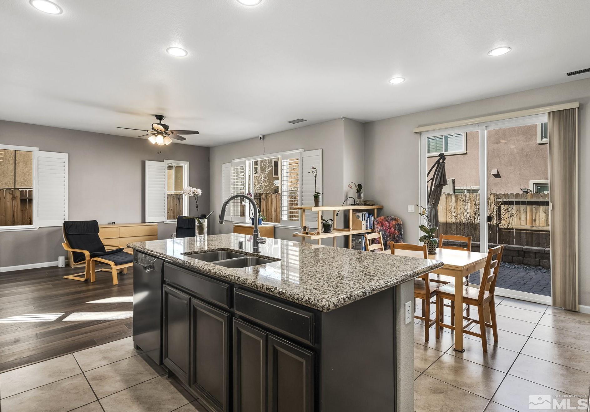 2055 Hope Valley Drive Reno, NV 89521 - Photo 5 of 21 a kitchen with center island table and chairs