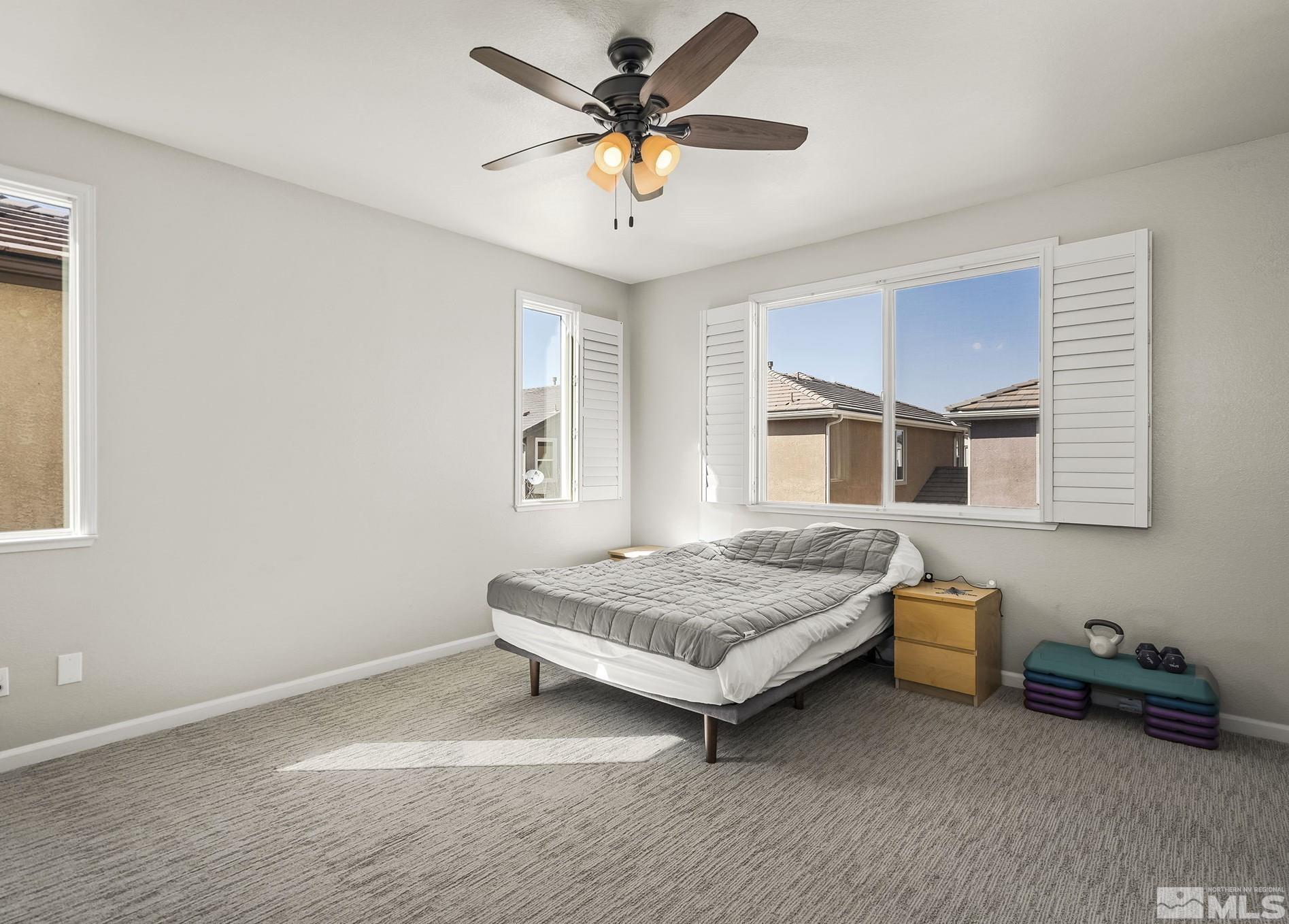 2055 Hope Valley Drive Reno, NV 89521 - Photo 9 of 21 a bedroom with a bed and a window