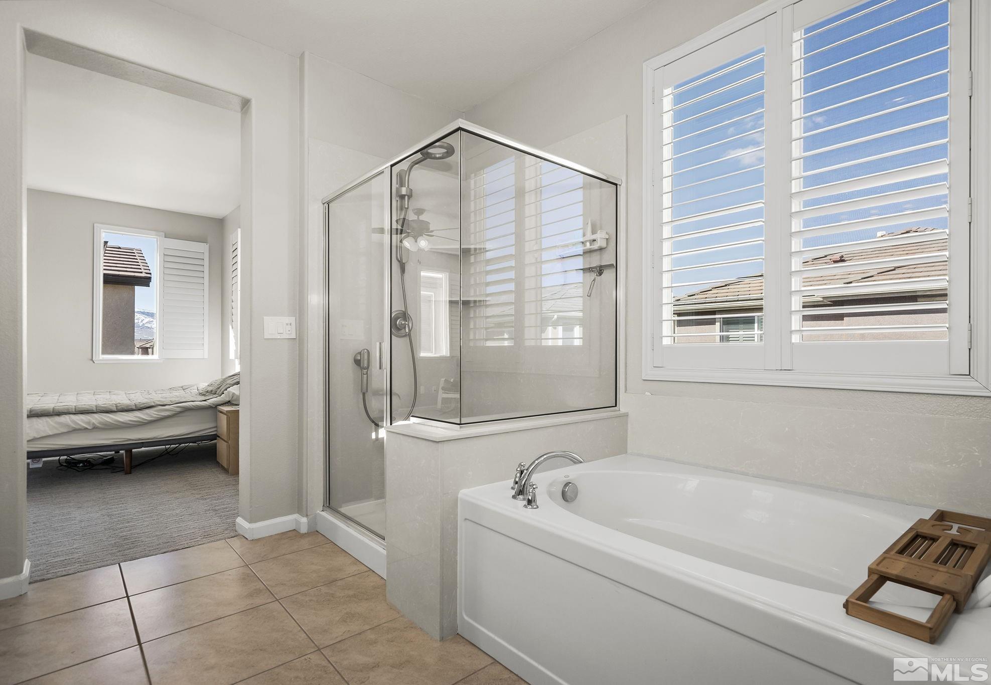 2055 Hope Valley Drive Reno, NV 89521 - Photo 10 of 21 a bathroom with a tub a toilet and a shower