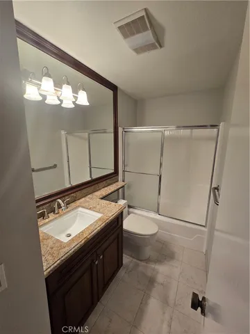 a bathroom with a sink a mirror and a shower