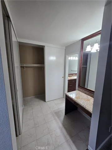 a view of kitchen with refrigerator and wooden floor
