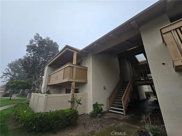 a front view of a house with stairs