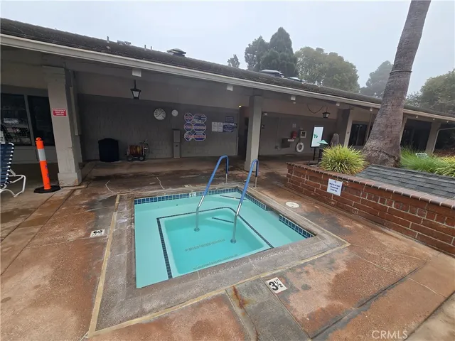 a view of a house with a tub and wooden floor