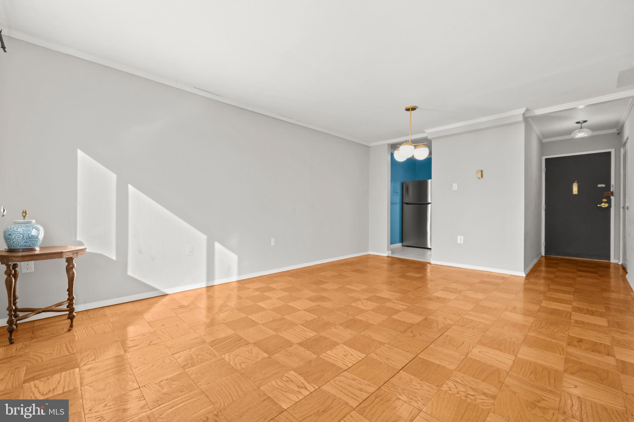 4555 MacArthur Boulevard Northwest, Unit 202 Washington, DC 20007 - Photo 6 of 27 a view of an empty room with wooden floor