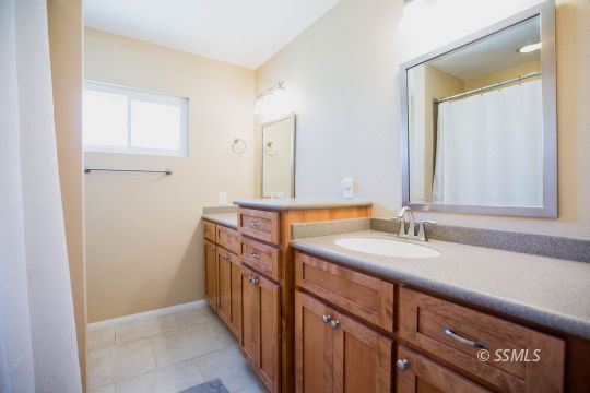 2030 South Inyo Street Ridgecrest, CA 93555 - Photo 23 of 42 a bathroom with a sink and a mirror