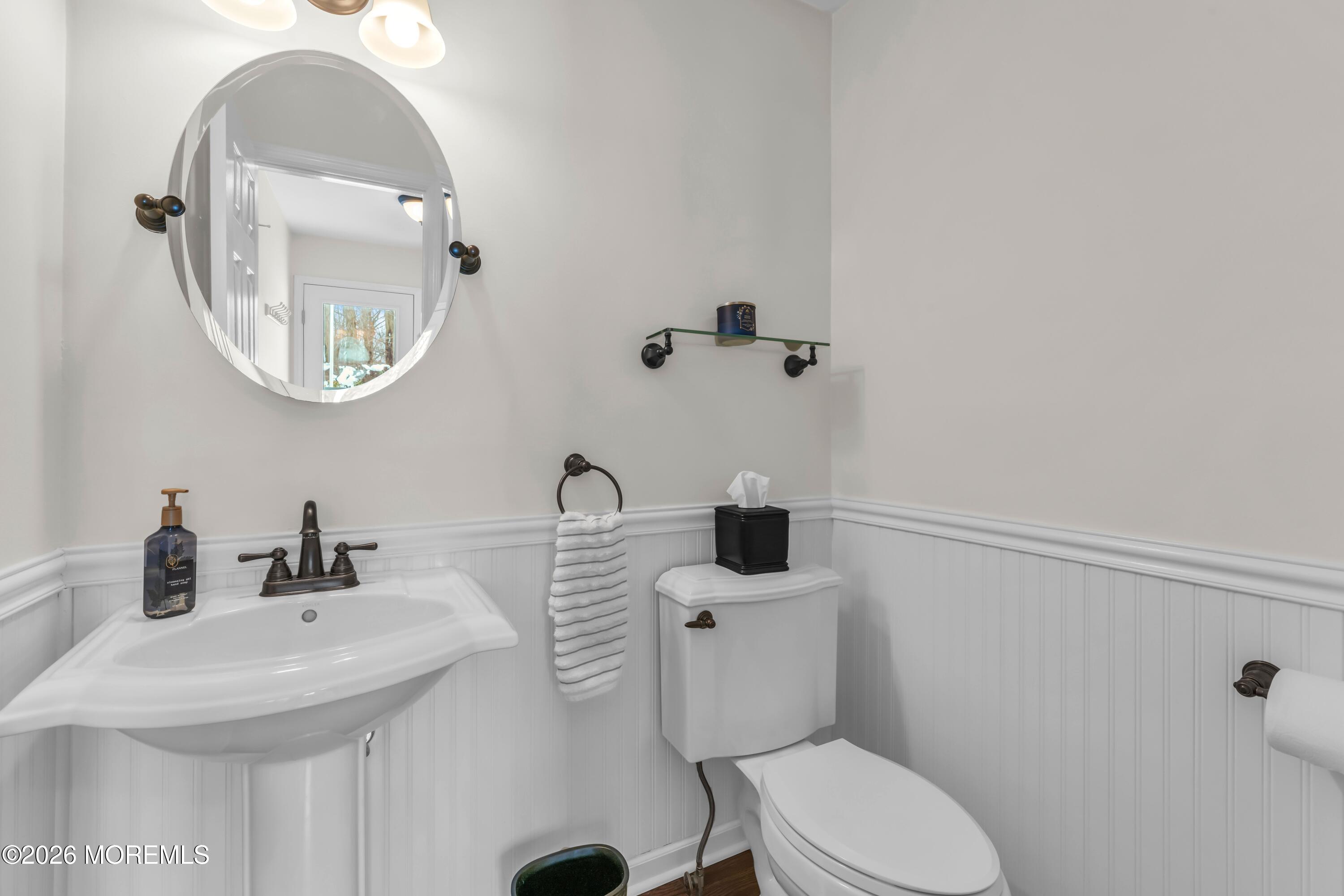 9 Johnny Court Red Bank, NJ 07701 - Photo 23 of 69 a bathroom with a toilet sink and mirror