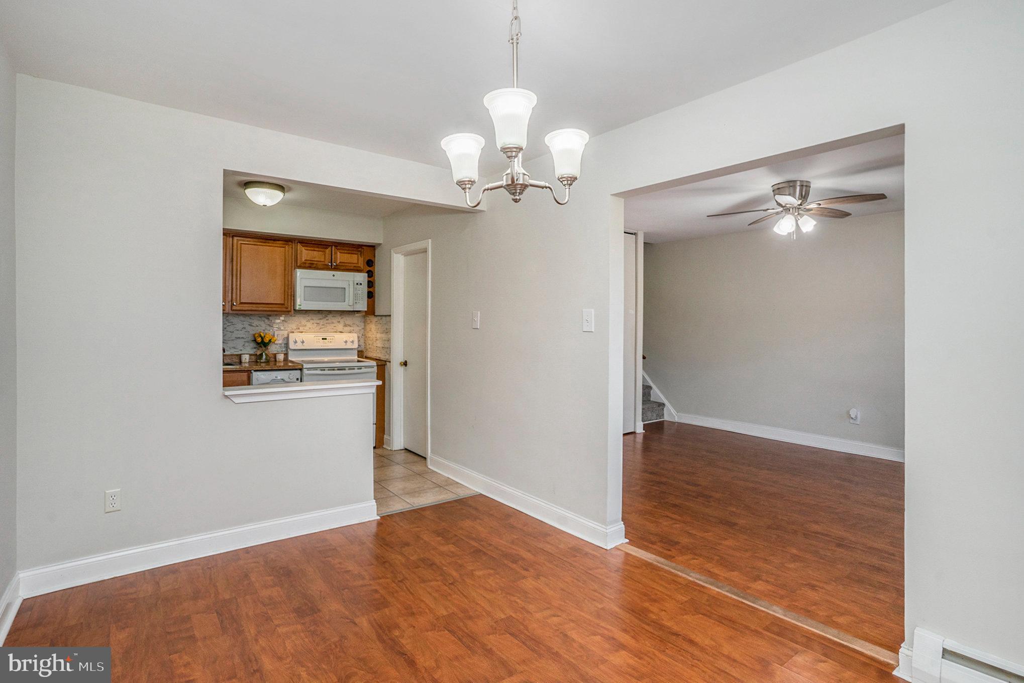 207 Walnut Hill Road, Unit B4 West Chester, PA 19382 - Photo 11 of 35 wooden floor in an empty room with a window