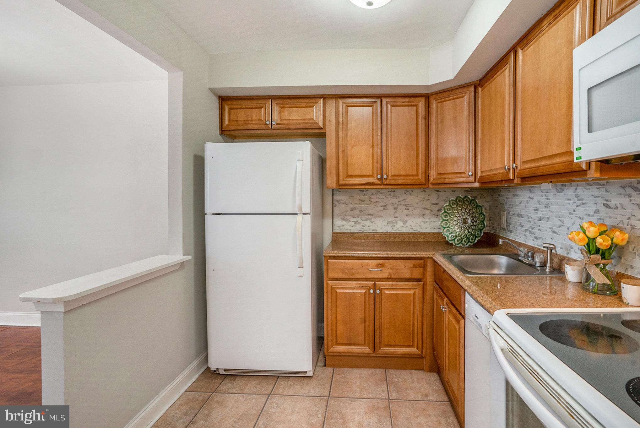 207 Walnut Hill Road, Unit B4 West Chester, PA 19382 - Photo 14 of 35 a kitchen with a refrigerator sink and cabinets
