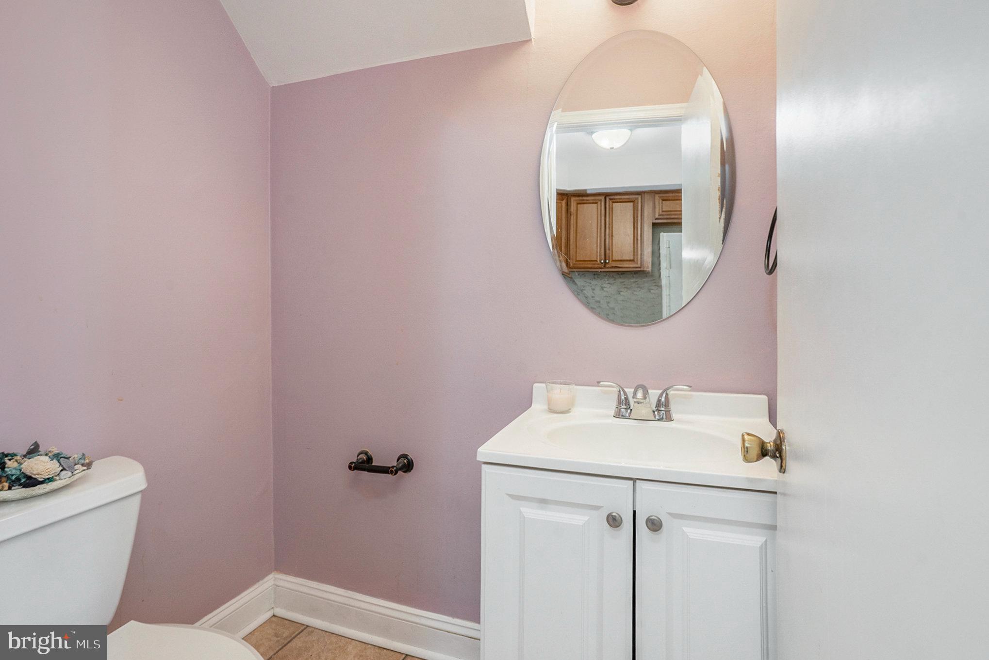 207 Walnut Hill Road, Unit B4 West Chester, PA 19382 - Photo 17 of 35 a bathroom with a sink mirror and toilet