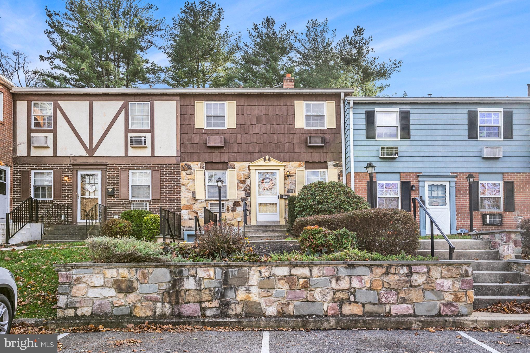 207 Walnut Hill Road, Unit B4 West Chester, PA 19382 - Photo 2 of 35 a front view of a house with garden
