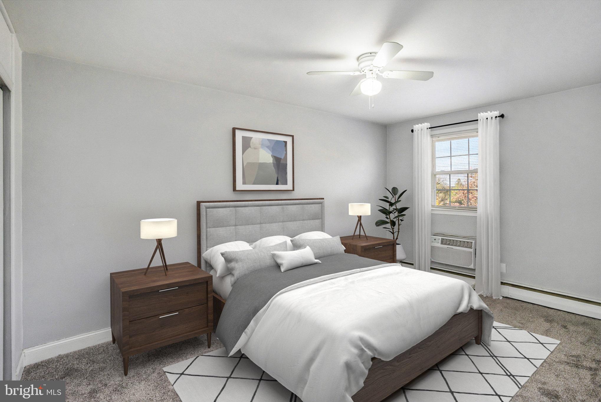 207 Walnut Hill Road, Unit B4 West Chester, PA 19382 - Photo 21 of 35 a bedroom with a bed and a chandelier